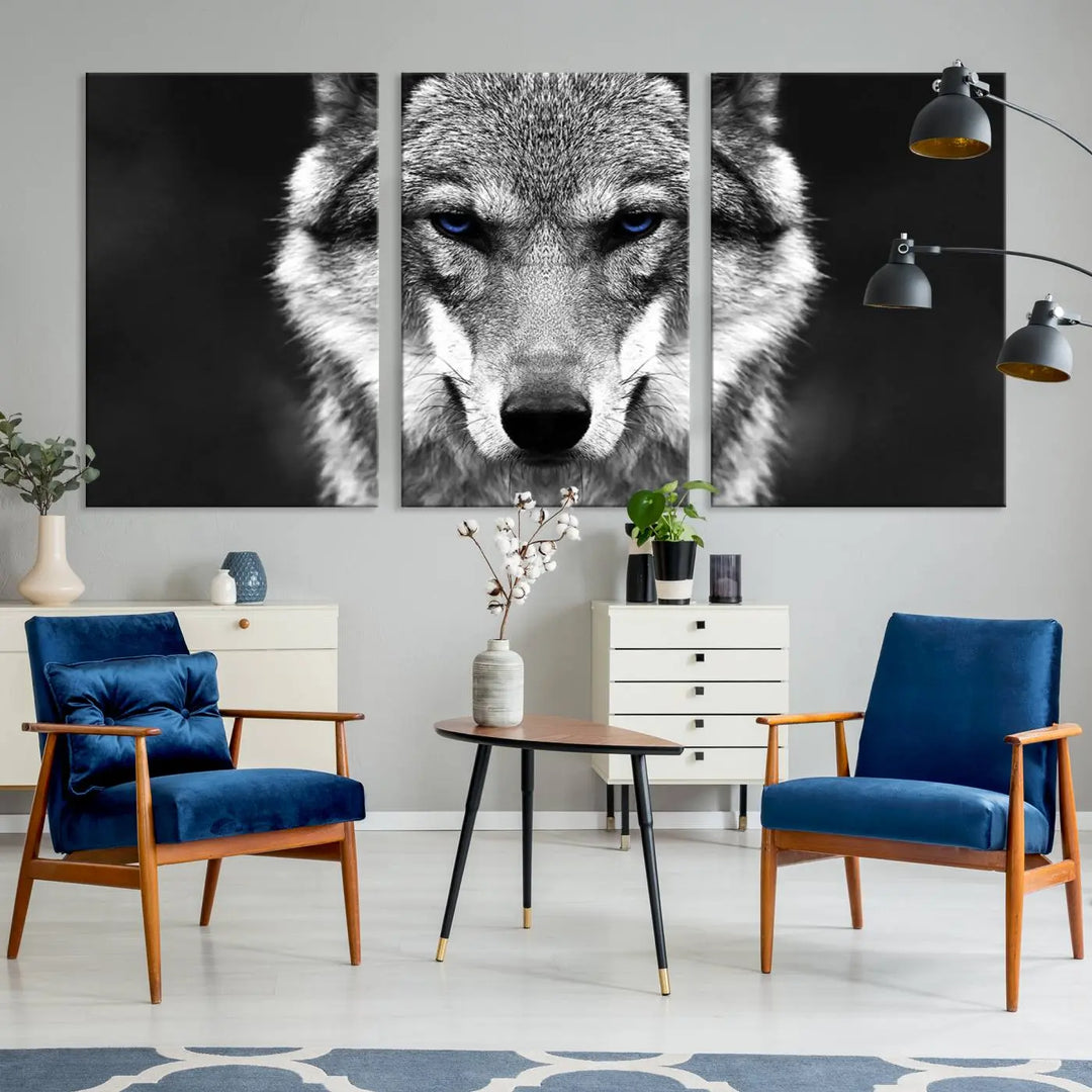 The Black and White Wild Wolf Wall Art Canvas Print, featuring a wolf with striking blue eyes, beautifully enhances any space. As a museum-quality piece with UV-protective coating and ready-to-hang design, it effortlessly brings elegance and convenience to your room.