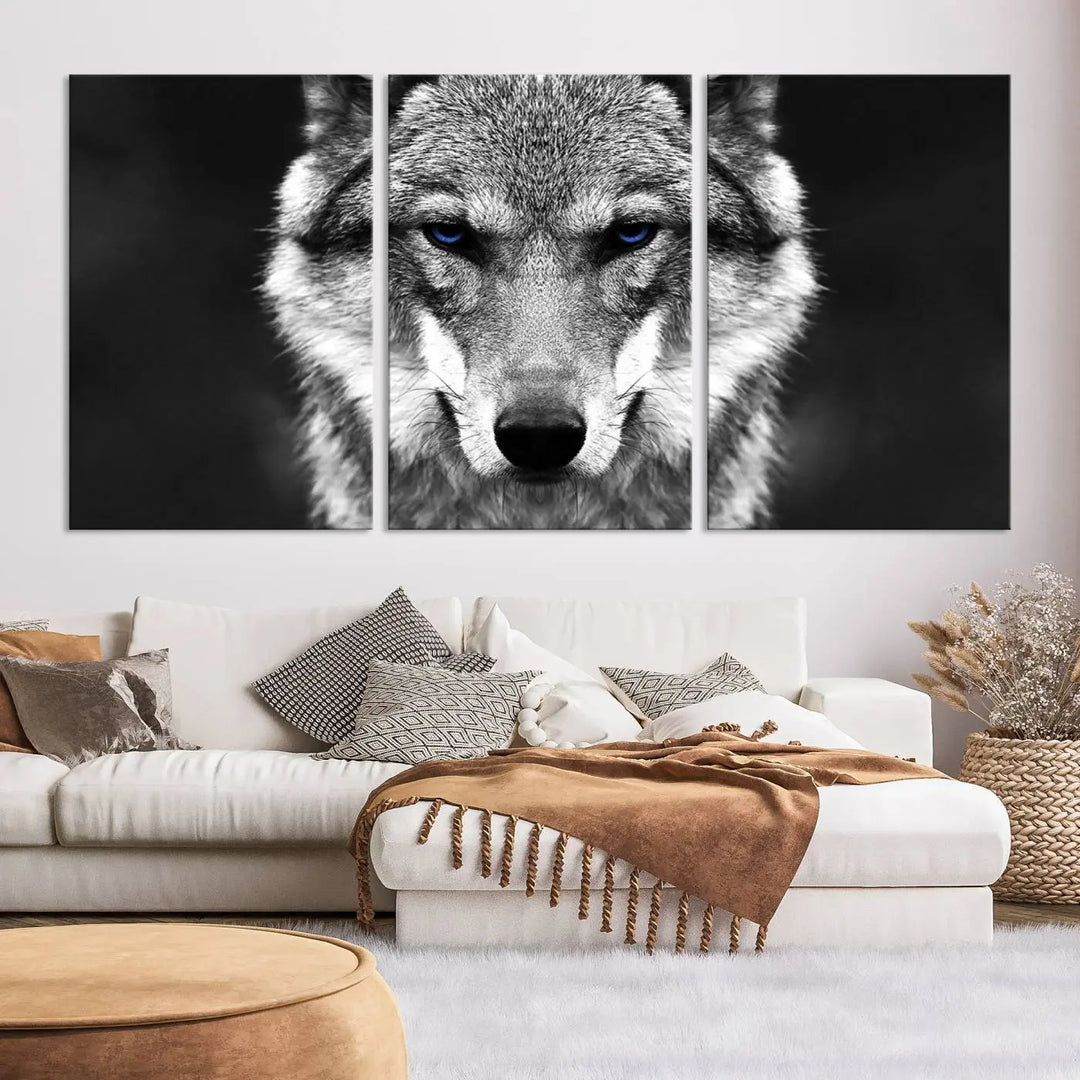 The Black and White Wild Wolf Wall Art Canvas Print, featuring a wolf with striking blue eyes, beautifully enhances any space. As a museum-quality piece with UV-protective coating and ready-to-hang design, it effortlessly brings elegance and convenience to your room.