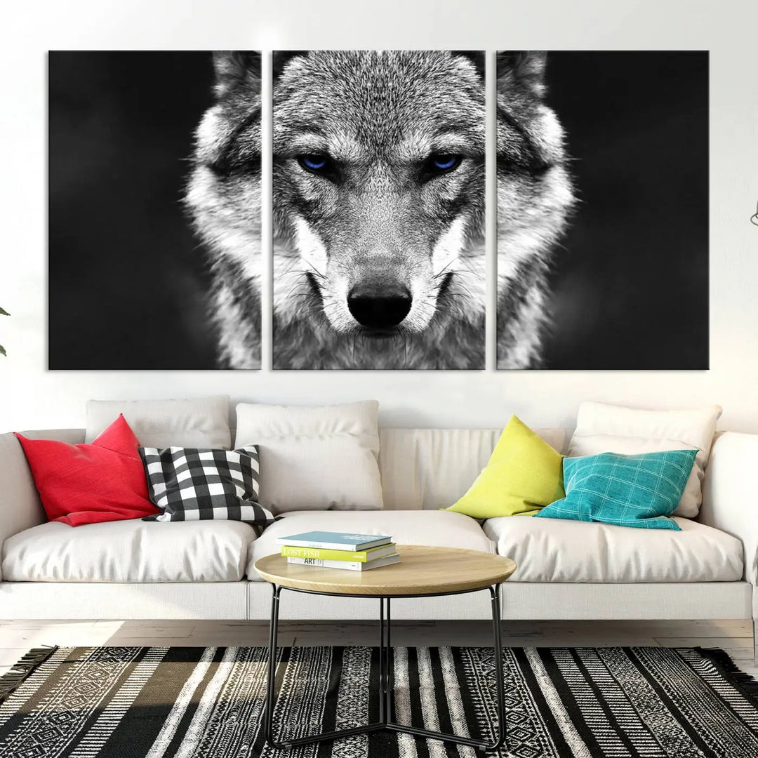 The Black and White Wild Wolf Wall Art Canvas Print, featuring a wolf with striking blue eyes, beautifully enhances any space. As a museum-quality piece with UV-protective coating and ready-to-hang design, it effortlessly brings elegance and convenience to your room.