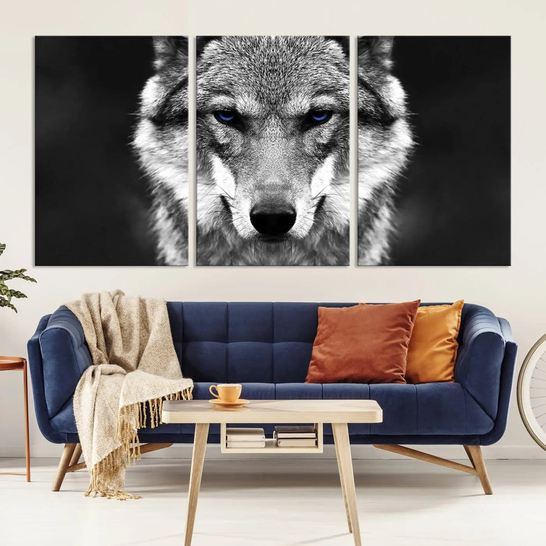 The Black and White Wild Wolf Wall Art Canvas Print, featuring a wolf with striking blue eyes, beautifully enhances any space. As a museum-quality piece with UV-protective coating and ready-to-hang design, it effortlessly brings elegance and convenience to your room.