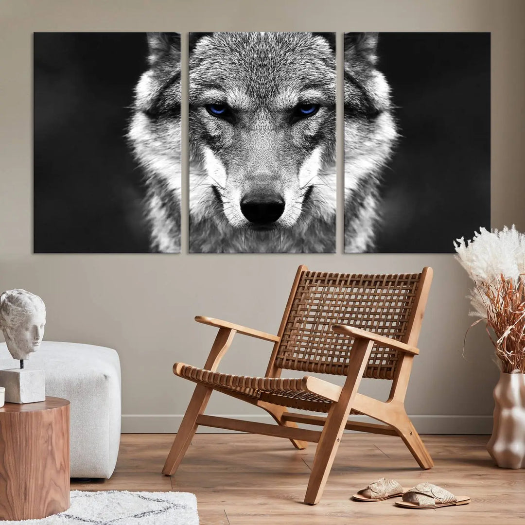 The Black and White Wild Wolf Wall Art Canvas Print, featuring a wolf with striking blue eyes, beautifully enhances any space. As a museum-quality piece with UV-protective coating and ready-to-hang design, it effortlessly brings elegance and convenience to your room.