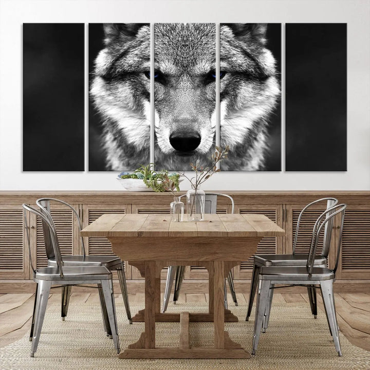 The Black and White Wild Wolf Wall Art Canvas Print, featuring a wolf with striking blue eyes, beautifully enhances any space. As a museum-quality piece with UV-protective coating and ready-to-hang design, it effortlessly brings elegance and convenience to your room.