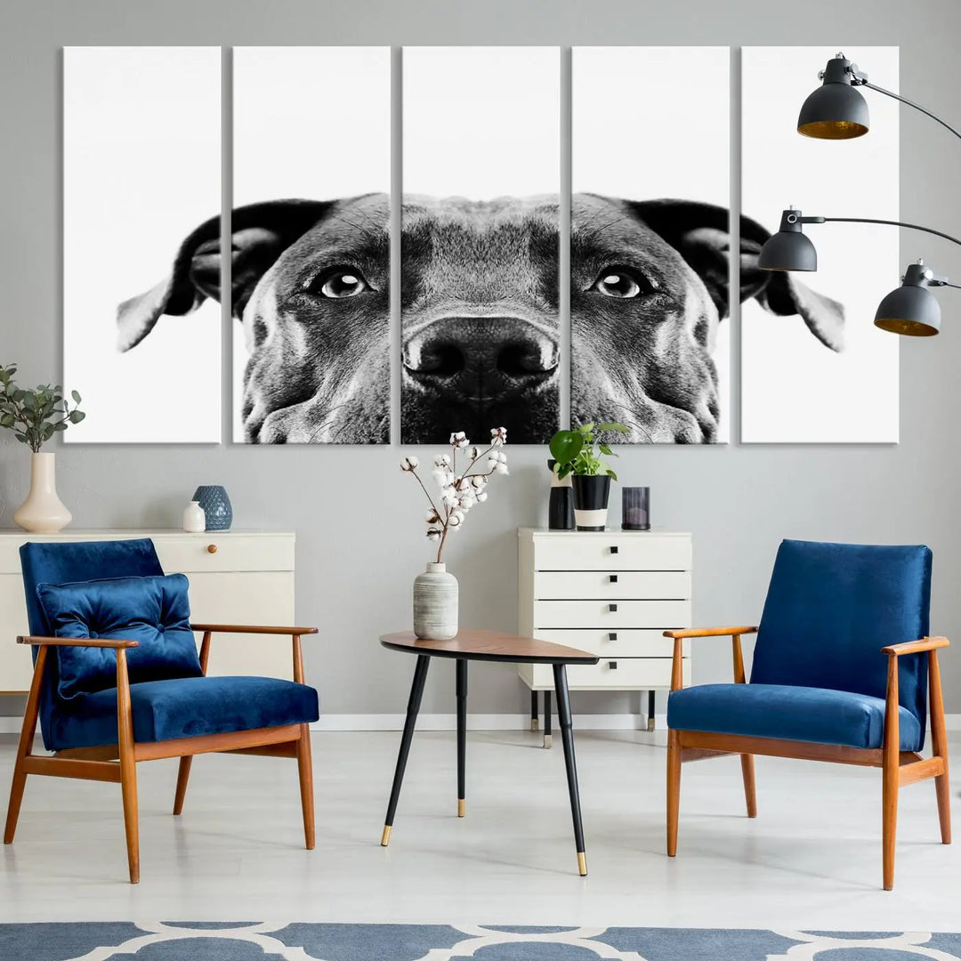 The "Black and White Pit Bull Dog Wall Art Canvas Print" elegantly adorns the living room, infusing character and charm into the contemporary setting. This captivating piece is perfect for dog lovers.