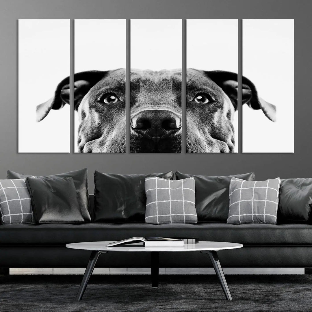 The "Black and White Pit Bull Dog Wall Art Canvas Print" elegantly adorns the living room, infusing character and charm into the contemporary setting. This captivating piece is perfect for dog lovers.