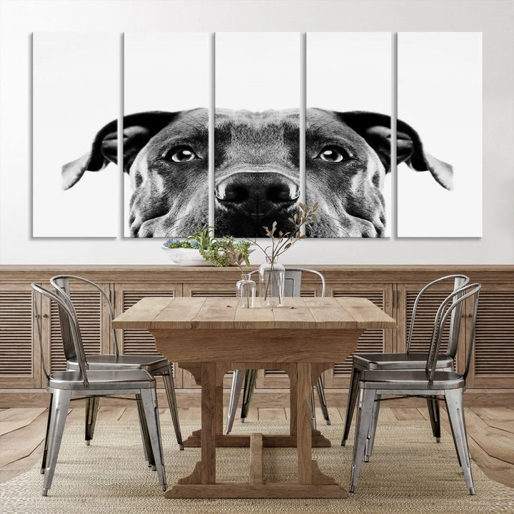 The "Black and White Pit Bull Dog Wall Art Canvas Print" elegantly adorns the living room, infusing character and charm into the contemporary setting. This captivating piece is perfect for dog lovers.