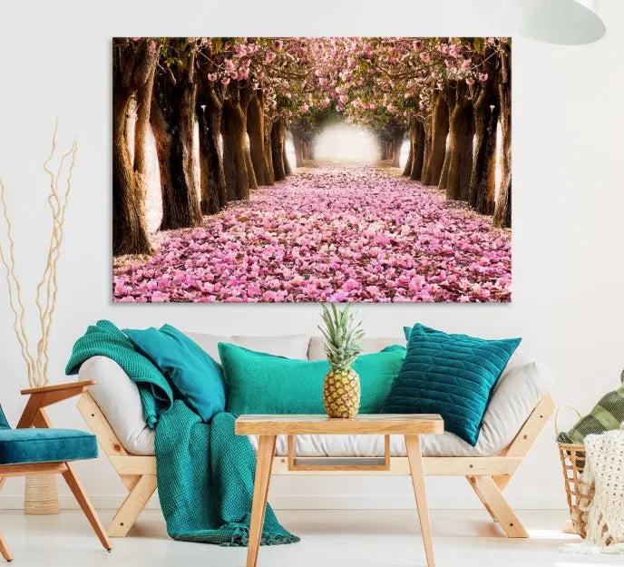 The Blossom Cherry Trees Wall Art Canvas Print, featuring a three-panel design on museum-quality canvas, showcases a tree-lined path with pink flowers. Each panel is gallery wrapped to add an extra layer of sophistication.