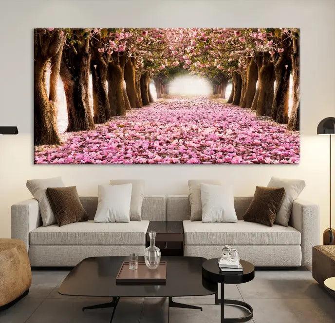 The Blossom Cherry Trees Wall Art Canvas Print, featuring a three-panel design on museum-quality canvas, showcases a tree-lined path with pink flowers. Each panel is gallery wrapped to add an extra layer of sophistication.