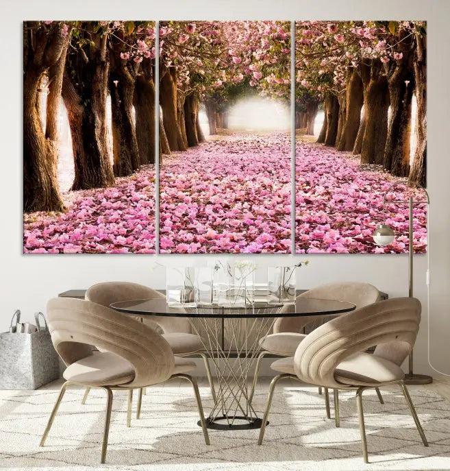 The Blossom Cherry Trees Wall Art Canvas Print, featuring a three-panel design on museum-quality canvas, showcases a tree-lined path with pink flowers. Each panel is gallery wrapped to add an extra layer of sophistication.