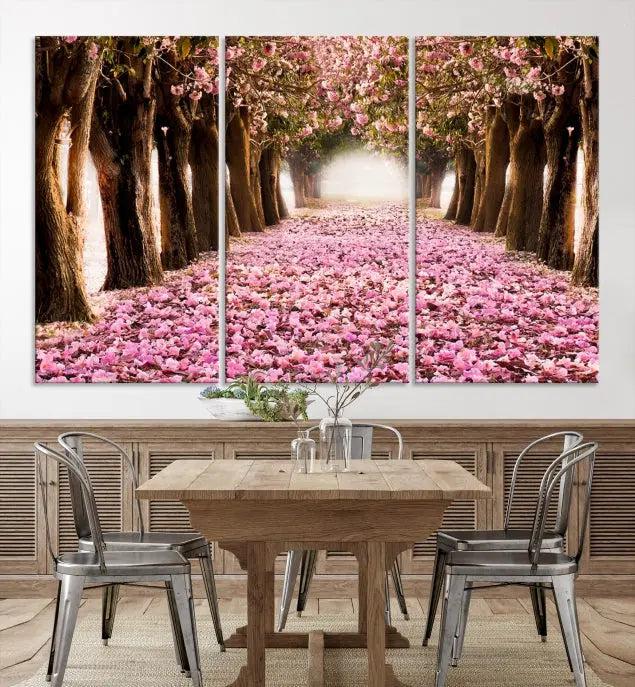 The Blossom Cherry Trees Wall Art Canvas Print, featuring a three-panel design on museum-quality canvas, showcases a tree-lined path with pink flowers. Each panel is gallery wrapped to add an extra layer of sophistication.