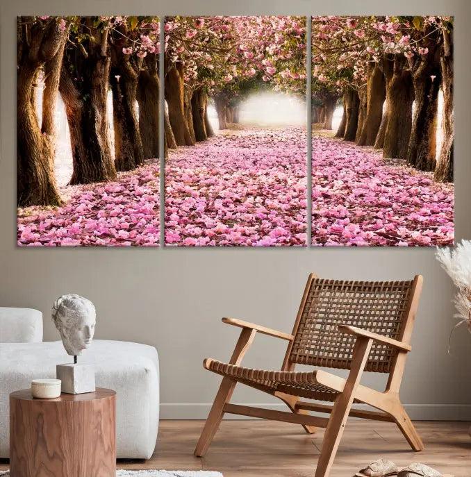 The Blossom Cherry Trees Wall Art Canvas Print, featuring a three-panel design on museum-quality canvas, showcases a tree-lined path with pink flowers. Each panel is gallery wrapped to add an extra layer of sophistication.