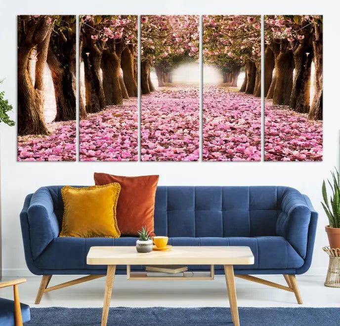 The Blossom Cherry Trees Wall Art Canvas Print, featuring a three-panel design on museum-quality canvas, showcases a tree-lined path with pink flowers. Each panel is gallery wrapped to add an extra layer of sophistication.