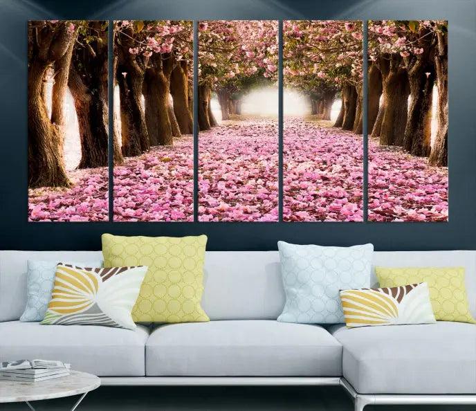 The Blossom Cherry Trees Wall Art Canvas Print, featuring a three-panel design on museum-quality canvas, showcases a tree-lined path with pink flowers. Each panel is gallery wrapped to add an extra layer of sophistication.