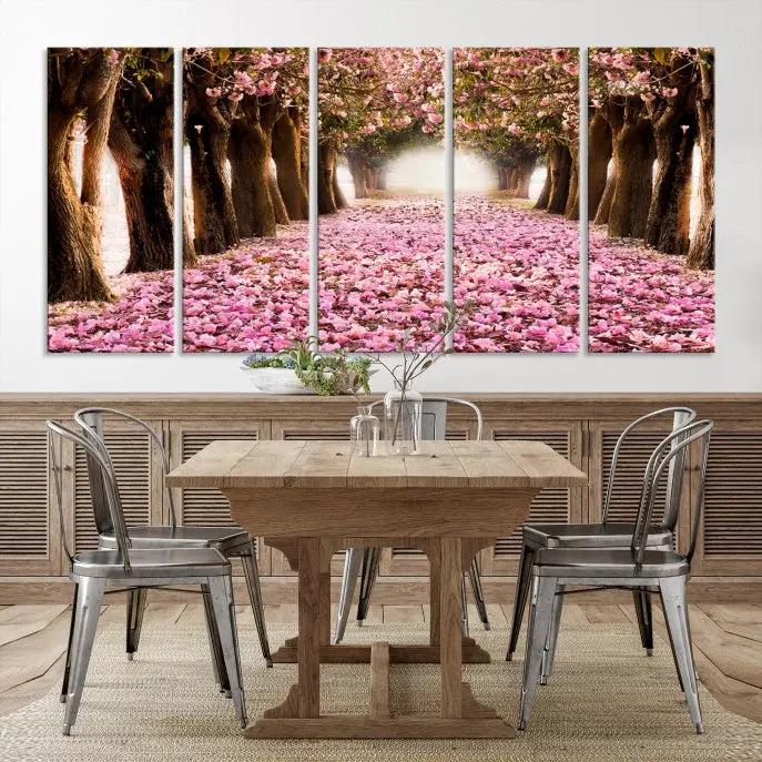 The Blossom Cherry Trees Wall Art Canvas Print, featuring a three-panel design on museum-quality canvas, showcases a tree-lined path with pink flowers. Each panel is gallery wrapped to add an extra layer of sophistication.