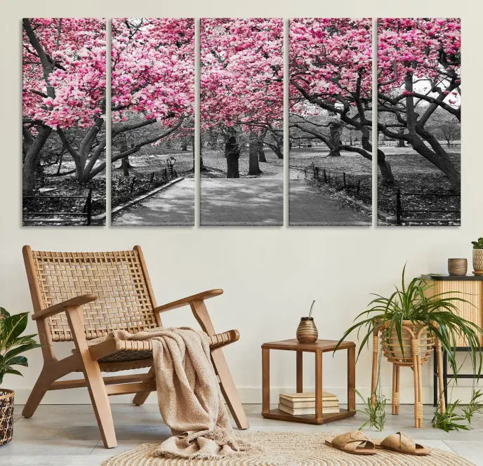 The "Blossom Cherry Trees and Leaves Wall Art Canvas Print" is a gallery-wrapped canvas that features a stunning depiction of a park path lined with pink blossoming trees in sepia tones. Its timeless beauty is preserved with a UV-protective coating.