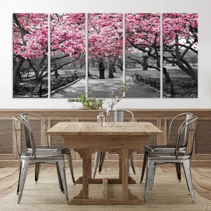 The "Blossom Cherry Trees and Leaves Wall Art Canvas Print" is a gallery-wrapped canvas that features a stunning depiction of a park path lined with pink blossoming trees in sepia tones. Its timeless beauty is preserved with a UV-protective coating.