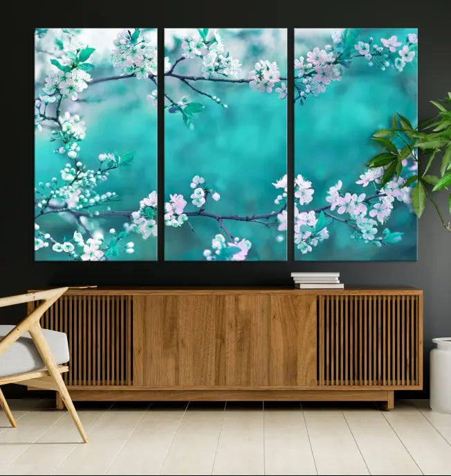 A living room enhanced by a gallery-wrapped "Blossoming Cherry in Spring" wall art canvas print. Enjoy this museum-quality piece with free shipping.