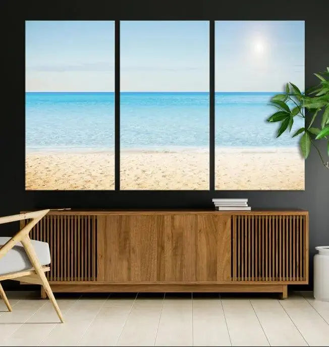 The Blue Beach and Sea Wall Art Canvas Print, arranged in a three-panel beach scene, elegantly decorates a black wall. Transform your space into a coastal oasis with this stunning piece, and enjoy free shipping on your purchase.