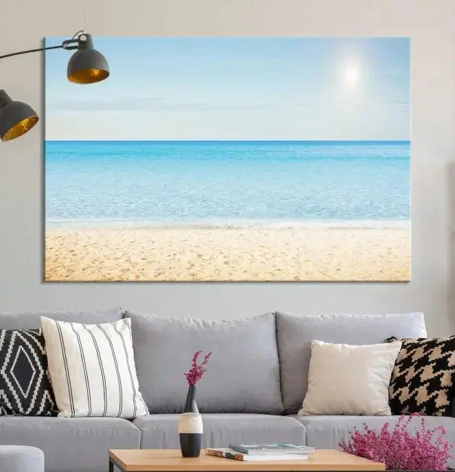 The Blue Beach and Sea Wall Art Canvas Print, arranged in a three-panel beach scene, elegantly decorates a black wall. Transform your space into a coastal oasis with this stunning piece, and enjoy free shipping on your purchase.