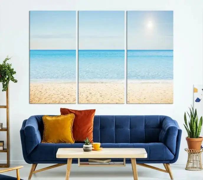 The Blue Beach and Sea Wall Art Canvas Print, arranged in a three-panel beach scene, elegantly decorates a black wall. Transform your space into a coastal oasis with this stunning piece, and enjoy free shipping on your purchase.