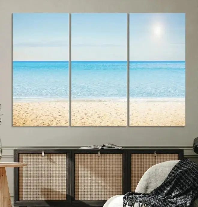 The Blue Beach and Sea Wall Art Canvas Print, arranged in a three-panel beach scene, elegantly decorates a black wall. Transform your space into a coastal oasis with this stunning piece, and enjoy free shipping on your purchase.