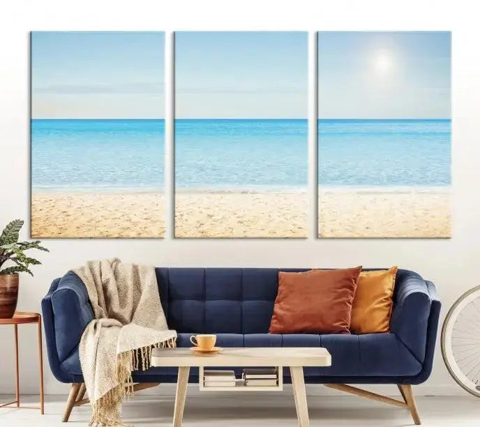 The Blue Beach and Sea Wall Art Canvas Print, arranged in a three-panel beach scene, elegantly decorates a black wall. Transform your space into a coastal oasis with this stunning piece, and enjoy free shipping on your purchase.