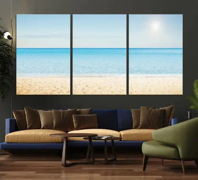 The Blue Beach and Sea Wall Art Canvas Print, arranged in a three-panel beach scene, elegantly decorates a black wall. Transform your space into a coastal oasis with this stunning piece, and enjoy free shipping on your purchase.