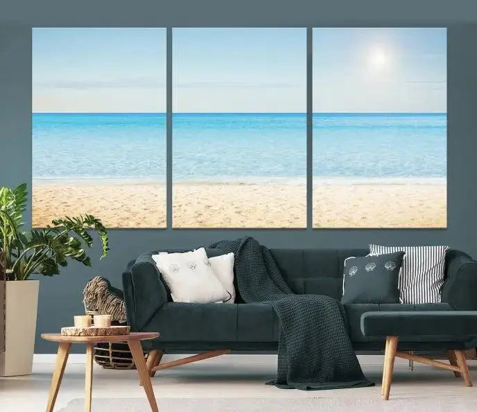 The Blue Beach and Sea Wall Art Canvas Print, arranged in a three-panel beach scene, elegantly decorates a black wall. Transform your space into a coastal oasis with this stunning piece, and enjoy free shipping on your purchase.