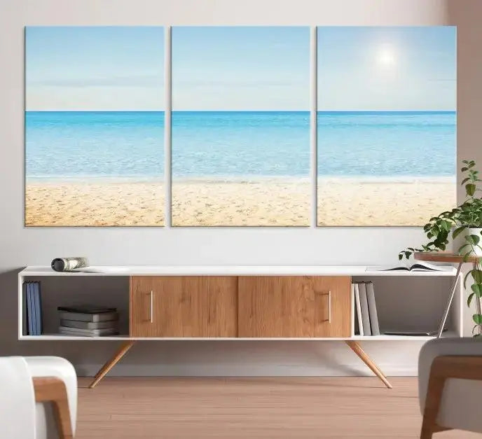 The Blue Beach and Sea Wall Art Canvas Print, arranged in a three-panel beach scene, elegantly decorates a black wall. Transform your space into a coastal oasis with this stunning piece, and enjoy free shipping on your purchase.