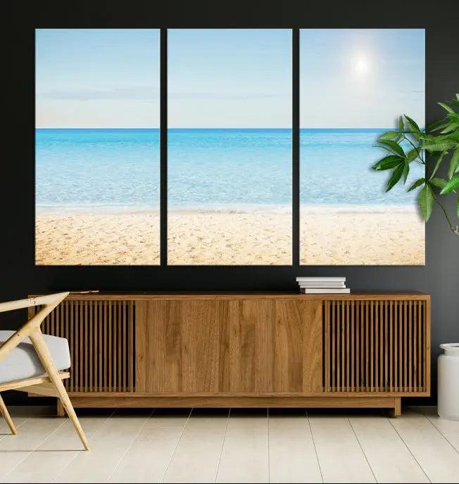 The Blue Beach and Sea Wall Art Canvas Print, arranged in a three-panel beach scene, elegantly decorates a black wall. Transform your space into a coastal oasis with this stunning piece, and enjoy free shipping on your purchase.