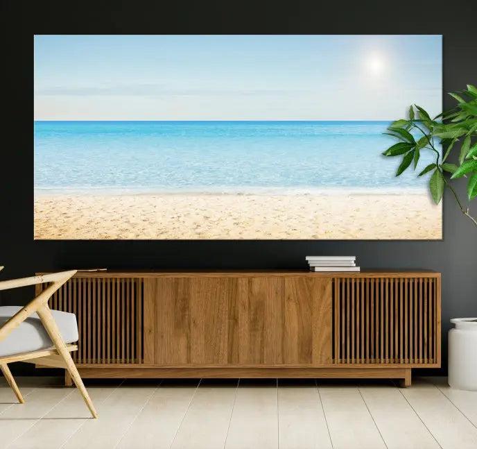 The Blue Beach and Sea Wall Art Canvas Print, arranged in a three-panel beach scene, elegantly decorates a black wall. Transform your space into a coastal oasis with this stunning piece, and enjoy free shipping on your purchase.