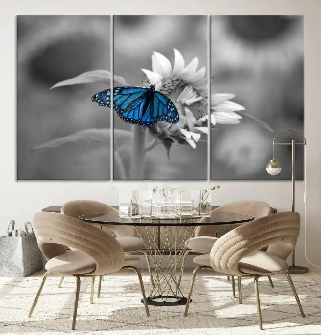 The modern living room showcases the Blue Butterfly Black and White Canvas Wall Art as a triptych. These museum-quality canvases, equipped with UV-protective coating and ready to hang, add both elegance and durability to the decor.