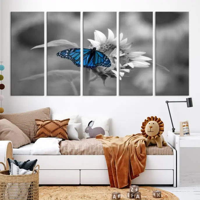 The modern living room showcases the Blue Butterfly Black and White Canvas Wall Art as a triptych. These museum-quality canvases, equipped with UV-protective coating and ready to hang, add both elegance and durability to the decor.