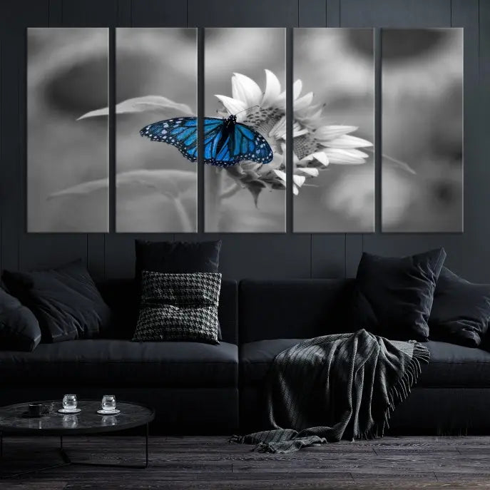 The modern living room showcases the Blue Butterfly Black and White Canvas Wall Art as a triptych. These museum-quality canvases, equipped with UV-protective coating and ready to hang, add both elegance and durability to the decor.