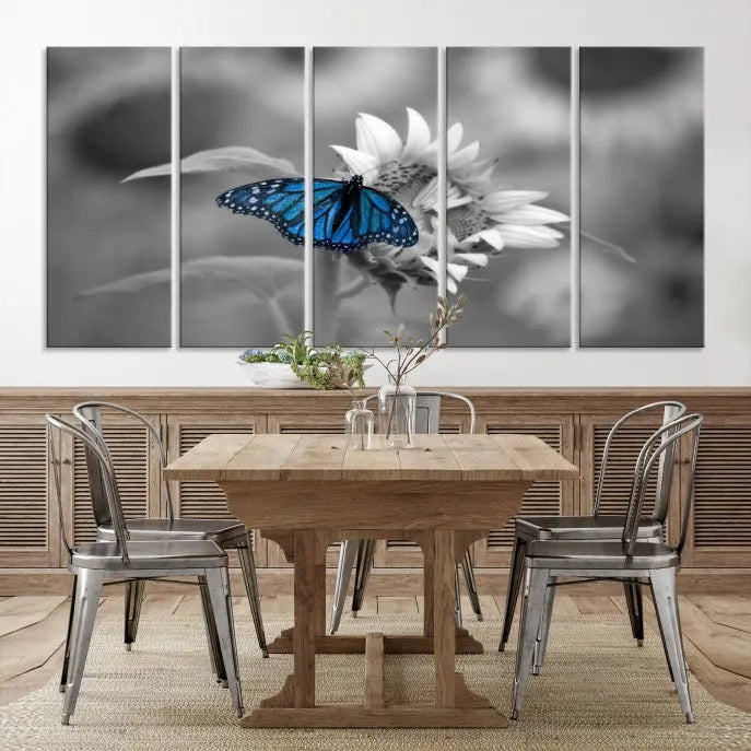 The modern living room showcases the Blue Butterfly Black and White Canvas Wall Art as a triptych. These museum-quality canvases, equipped with UV-protective coating and ready to hang, add both elegance and durability to the decor.