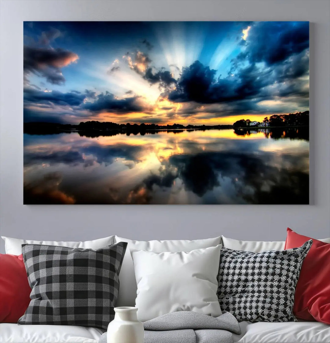 The "Blue Clouds and Sunshine Sunset Wall Art Canvas Print" perfectly captures a stunning sunset over a calm lake, where dramatic clouds and sunrays are beautifully reflected in the water. This museum-quality, ready-to-hang piece flawlessly preserves nature's breathtaking moment.