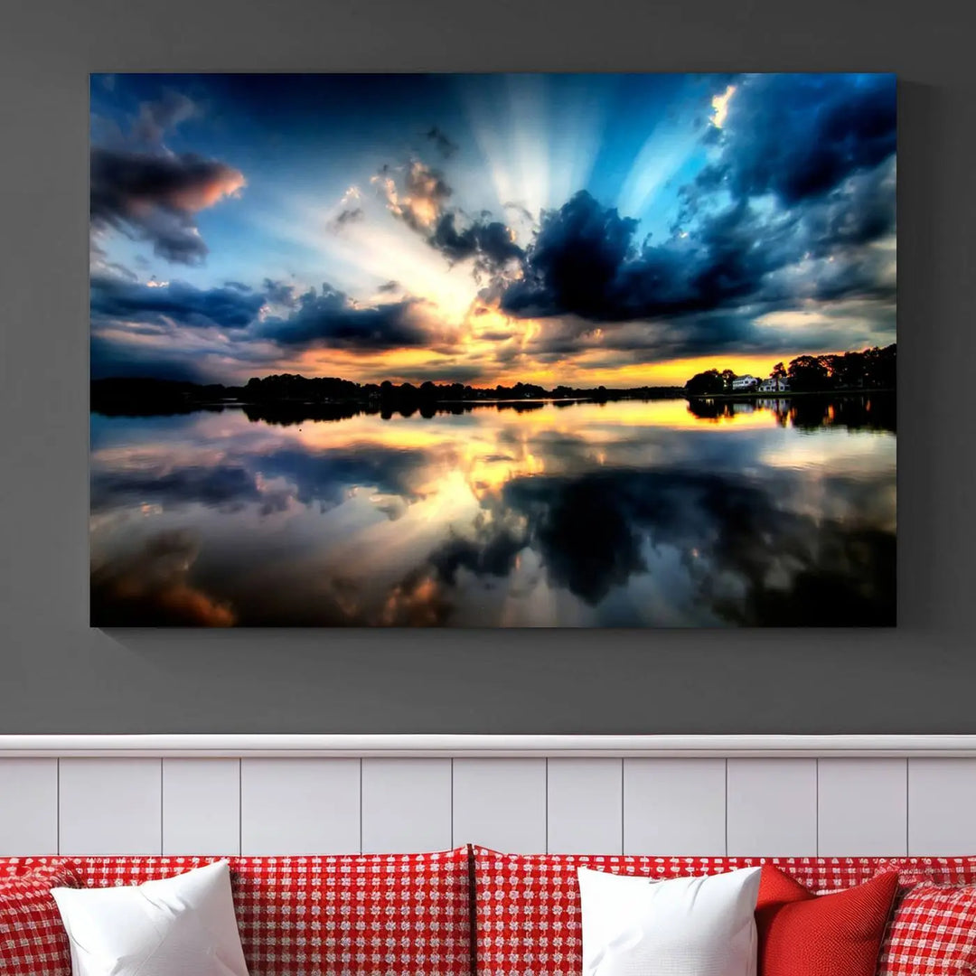 The "Blue Clouds and Sunshine Sunset Wall Art Canvas Print" perfectly captures a stunning sunset over a calm lake, where dramatic clouds and sunrays are beautifully reflected in the water. This museum-quality, ready-to-hang piece flawlessly preserves nature's breathtaking moment.