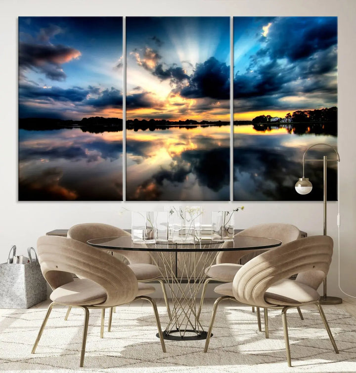 The "Blue Clouds and Sunshine Sunset Wall Art Canvas Print" perfectly captures a stunning sunset over a calm lake, where dramatic clouds and sunrays are beautifully reflected in the water. This museum-quality, ready-to-hang piece flawlessly preserves nature's breathtaking moment.