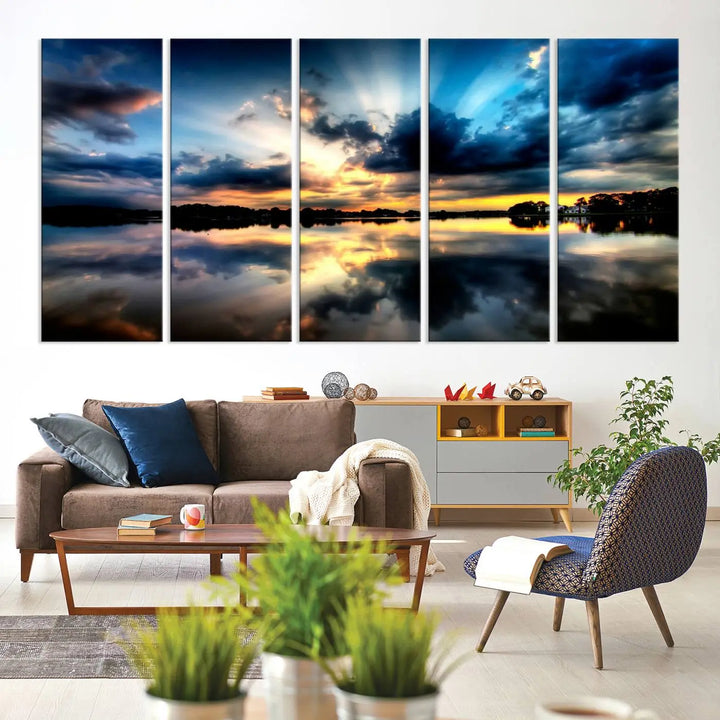 The "Blue Clouds and Sunshine Sunset Wall Art Canvas Print" perfectly captures a stunning sunset over a calm lake, where dramatic clouds and sunrays are beautifully reflected in the water. This museum-quality, ready-to-hang piece flawlessly preserves nature's breathtaking moment.