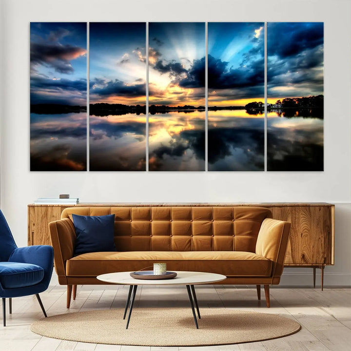 The "Blue Clouds and Sunshine Sunset Wall Art Canvas Print" perfectly captures a stunning sunset over a calm lake, where dramatic clouds and sunrays are beautifully reflected in the water. This museum-quality, ready-to-hang piece flawlessly preserves nature's breathtaking moment.