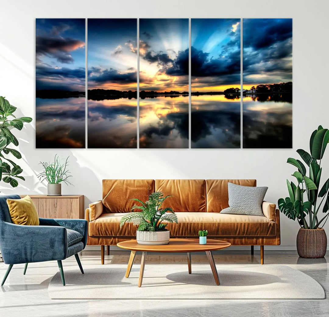 The "Blue Clouds and Sunshine Sunset Wall Art Canvas Print" perfectly captures a stunning sunset over a calm lake, where dramatic clouds and sunrays are beautifully reflected in the water. This museum-quality, ready-to-hang piece flawlessly preserves nature's breathtaking moment.