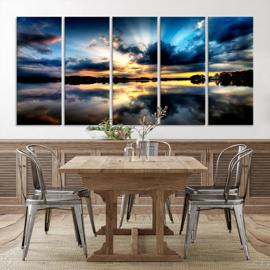 The "Blue Clouds and Sunshine Sunset Wall Art Canvas Print" perfectly captures a stunning sunset over a calm lake, where dramatic clouds and sunrays are beautifully reflected in the water. This museum-quality, ready-to-hang piece flawlessly preserves nature's breathtaking moment.