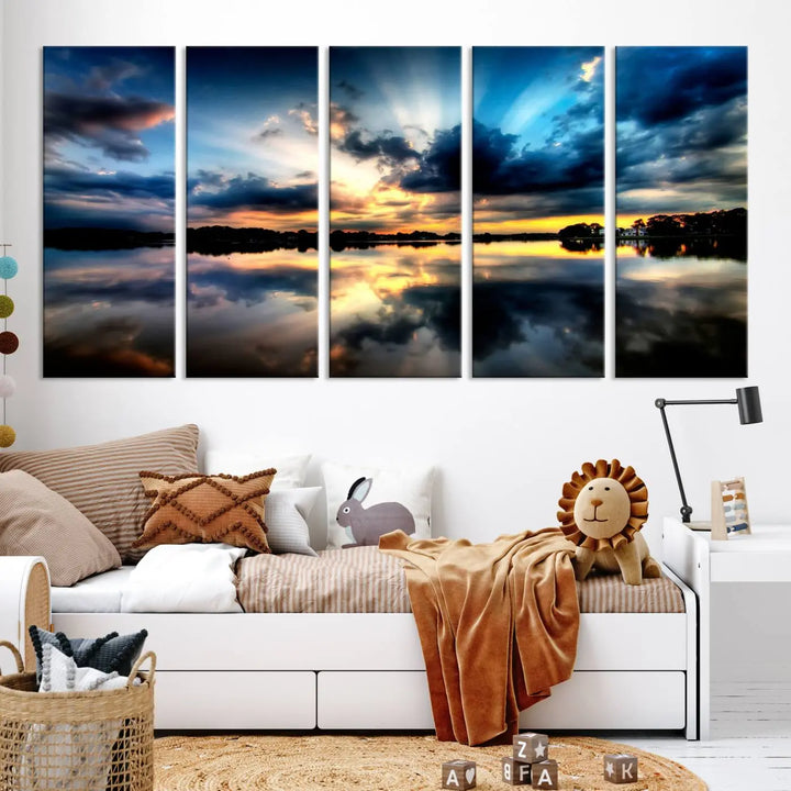 The "Blue Clouds and Sunshine Sunset Wall Art Canvas Print" perfectly captures a stunning sunset over a calm lake, where dramatic clouds and sunrays are beautifully reflected in the water. This museum-quality, ready-to-hang piece flawlessly preserves nature's breathtaking moment.