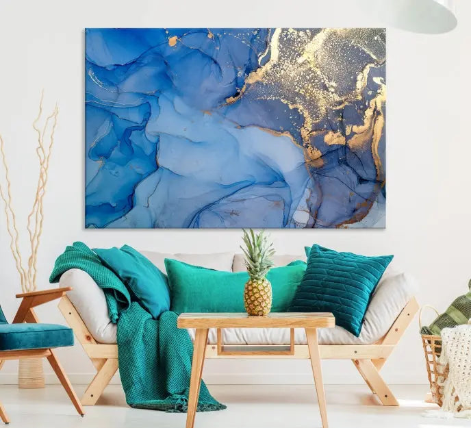 Modern living room featuring the Blue Gold Marble Fluid Canvas Wall Art that showcases three-panel abstract designs in blue and gold on museum-quality canvas. These art pieces are professionally hand-assembled for an exquisite finish.