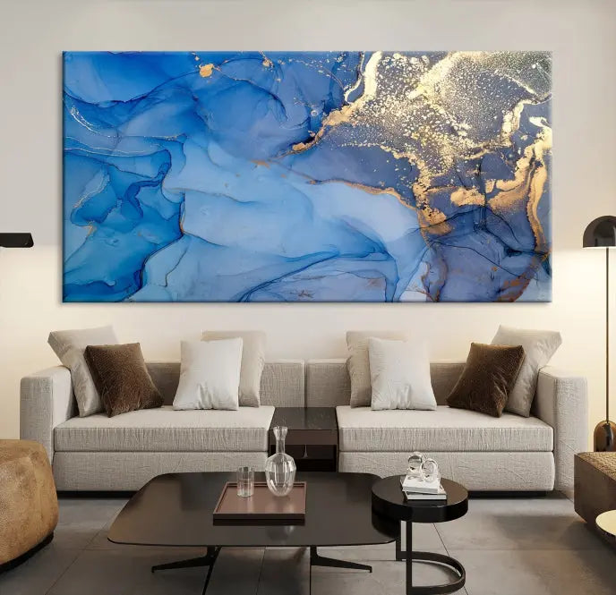 Modern living room featuring the Blue Gold Marble Fluid Canvas Wall Art that showcases three-panel abstract designs in blue and gold on museum-quality canvas. These art pieces are professionally hand-assembled for an exquisite finish.