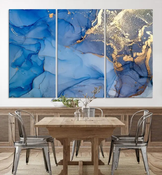 Modern living room featuring the Blue Gold Marble Fluid Canvas Wall Art that showcases three-panel abstract designs in blue and gold on museum-quality canvas. These art pieces are professionally hand-assembled for an exquisite finish.