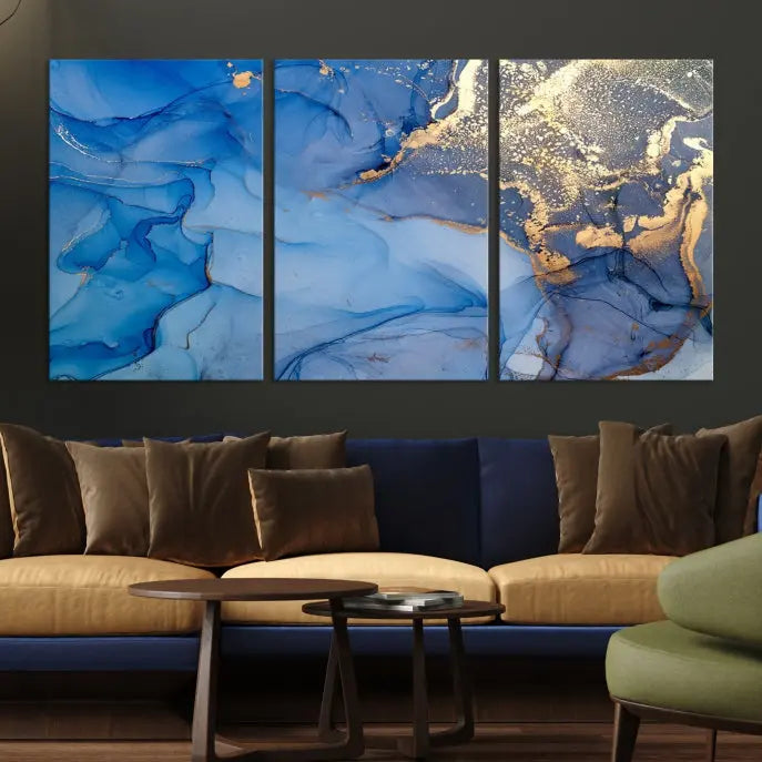 Modern living room featuring the Blue Gold Marble Fluid Canvas Wall Art that showcases three-panel abstract designs in blue and gold on museum-quality canvas. These art pieces are professionally hand-assembled for an exquisite finish.