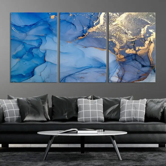 Modern living room featuring the Blue Gold Marble Fluid Canvas Wall Art that showcases three-panel abstract designs in blue and gold on museum-quality canvas. These art pieces are professionally hand-assembled for an exquisite finish.