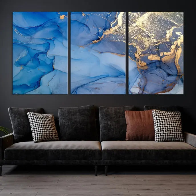 Modern living room featuring the Blue Gold Marble Fluid Canvas Wall Art that showcases three-panel abstract designs in blue and gold on museum-quality canvas. These art pieces are professionally hand-assembled for an exquisite finish.