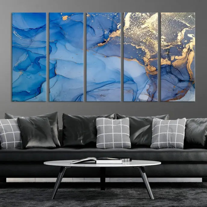 Modern living room featuring the Blue Gold Marble Fluid Canvas Wall Art that showcases three-panel abstract designs in blue and gold on museum-quality canvas. These art pieces are professionally hand-assembled for an exquisite finish.