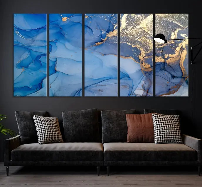 Modern living room featuring the Blue Gold Marble Fluid Canvas Wall Art that showcases three-panel abstract designs in blue and gold on museum-quality canvas. These art pieces are professionally hand-assembled for an exquisite finish.